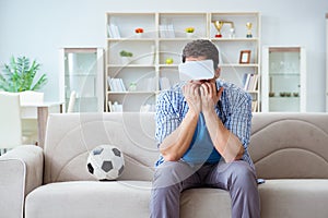 The man wearing virtual reality vr glasses watching soccer football