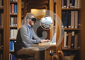 Man wearing VR Virtual Reality Headset with Interface and laptop