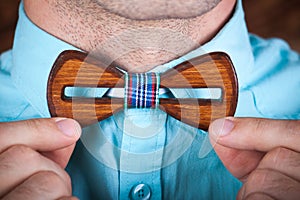 Man wearing a wooden tie.