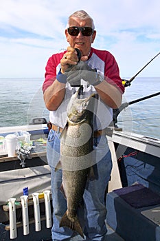 Man Weighing Large Fish - King Salmon