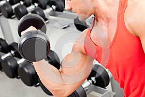 Man with weight training equipment on sport gym photo