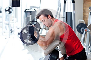 Man with weight training equipment on sport gym