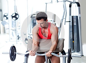 Man with weight training equipment on sport gym