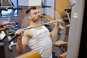 Man with weight training in gym equipment sport club