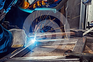 Man weld a metal welding machine