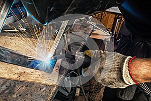 Man weld a metal welding machine