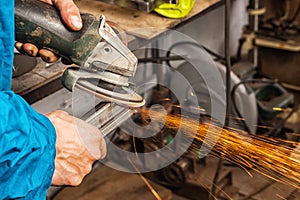 man welder grinder metal an angle grinder