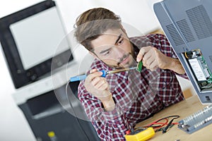 Man welding computer parts