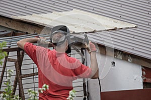 A man is welding metal at a construction site