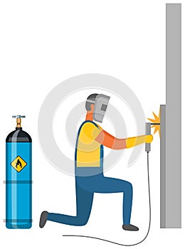 Man welding metal near gas cylinder. Welder works with equipment next to flammable container