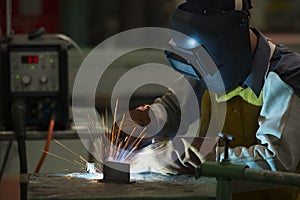 Man welding steel .