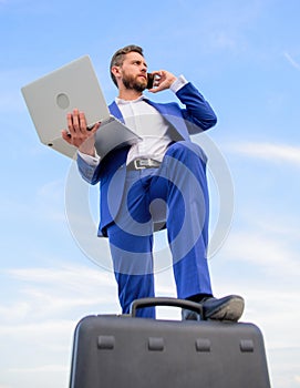 Man well groomed businessman holds laptop blue sky background. Guy formal suit modern technology manager entrepreneur