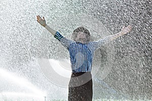 Man wet under rain farmer hat enjoy prayer happy upset heavy wet water shower sun summer pray