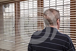 A man and wet window