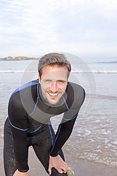 Man In Wetsuit on Beach