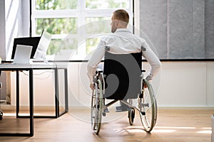 Man In Wheel Chair. Corporate Injury