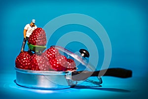 Man with wheelbarrow Healthy fresh raspberry