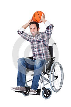 Man in wheelchair with basketball