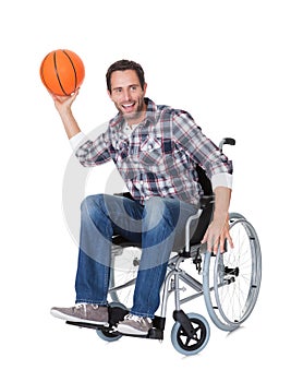 Man in wheelchair with basketball