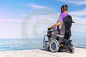 Man on wheelchair on the beach