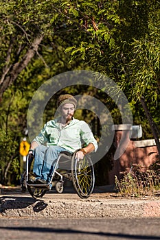 Man in Wheelchair at City Curb