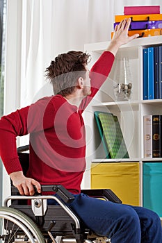 Man on wheelchair during everyday task