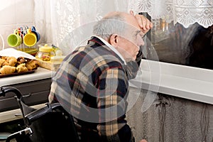 Man in a wheelchair peering through a window