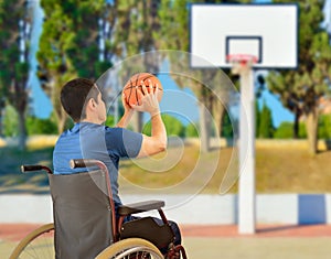 Man in wheelchair playing basketball