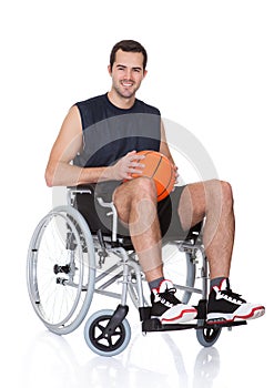 Man in wheelchair playing basketball