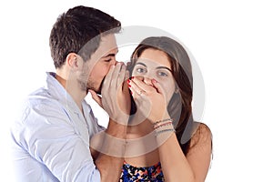 Man whispering to girlfriend.