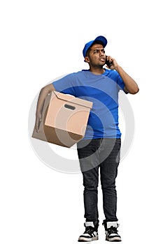 A man on a white background with box conversate on the phone photo