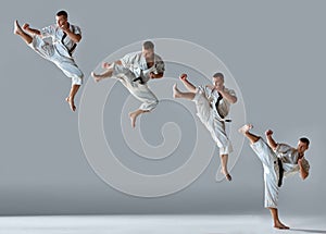 Man in white kimono training karate