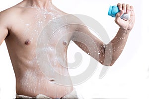 Man with a white powder on his body after shower isolated