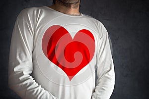 Man in white shirt with big red heart printed