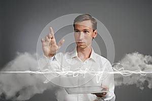 Man in white shirt making magic effect - flash lightning. The concept of electricity, high energy.