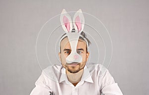 Man in the mask Easter rabbit looking at camera