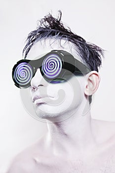 Man with white skin in strange violet glasses
