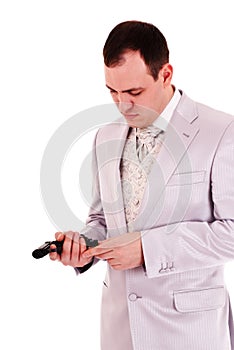 Man in white suit reload the gun