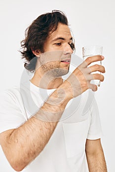 man in a white T-shirt glass of water Lifestyle unaltered