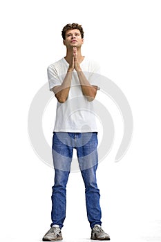 A man in a white T-shirt, on a white background, in full height, pleads