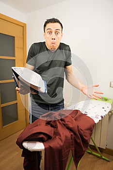 Man who does not know how to iron clothes