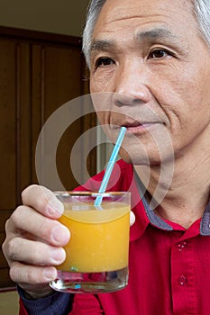 Man who drinking Orange juice