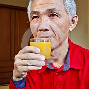 Man who drinking Orange juice