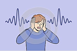 Man who has lost hearing clasps hands and screams, experiencing panic due to symptoms of disease