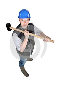 Man wielding heavy hammer