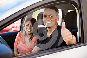 Man and wife driving their car