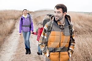 Man with wife and son backpacking