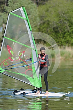 Man during wind surfing practice