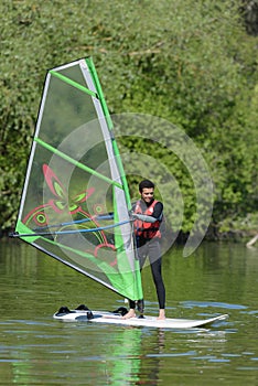 man during wind surfing practice