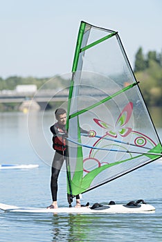 man during wind surfing practice